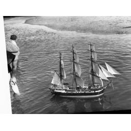 Model of HMS Buffalo at Glenelg, man at side watching