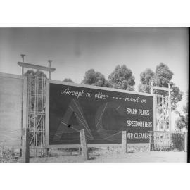 Billboard advertising AC sparkplugs - speedometers and air cleaners