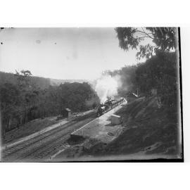Steam locomotive near station