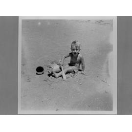 Young boy playing in the sand