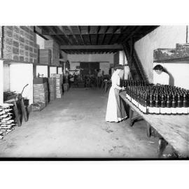 Bottling and packing wine - women working - St. Henry Claret