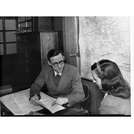 Vocational Guidance - Man and Woman at Desk