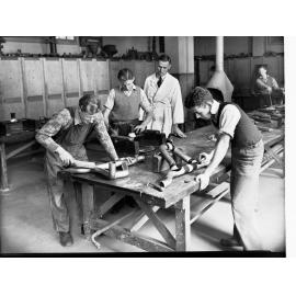 Plumbers Trade School Students Working on Pipes