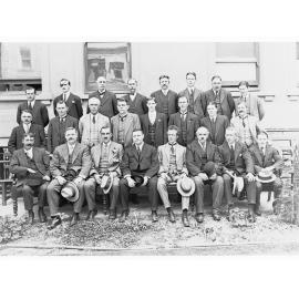 Repatriation Group - group of men outside building