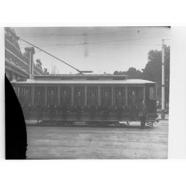 Tram showing conductors lined up along the side