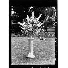 Flower Day - exhibit, pedestal with large vase of flowers