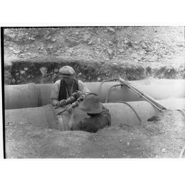 Men fixing pipeline, Darlington