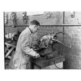 Students using trades school equipment