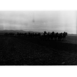 Horse teams pulling ploughing machinery