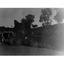 Parliamentary party on tour of Far North in Austin cars (government cars) - shows men bathing in river