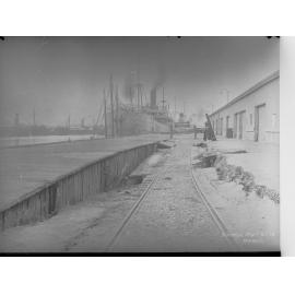 Birkenhead Wharf No. 2 Berth - shows steamship Australpool berthed at wharf and also shows subsidence in roadway
