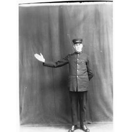 Porter demonstrating railway hand signals