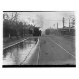 Surfacing a road with bitumen