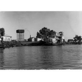 Renmark landing showing River Murray and paddlesteamer with sheds nearby