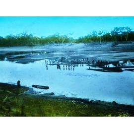 People Wading In and Standing by the Edge of the River Murray During Dry Season