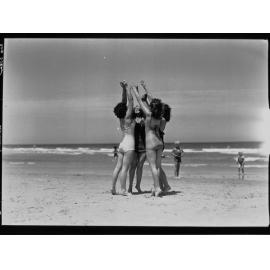 Four women on beach at Glenelg