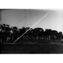 Sailors from HMS Hood running in a three-legged race at Willunga