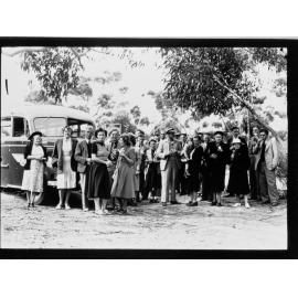 People standing in front of Merchant Tours bus - Coffin Bay