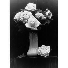 A Vase With Roses In It