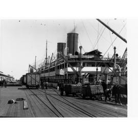Loading wool and fruit at Port Adelaide, showing steamship